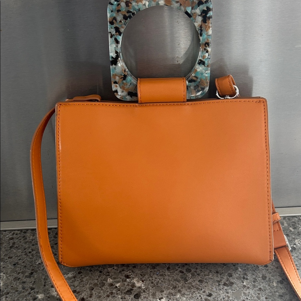 Orange Handbag with Unique Handle